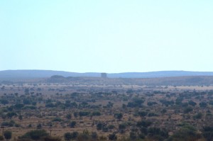 The HESS II structure dominates the landscape while still kilometers away.